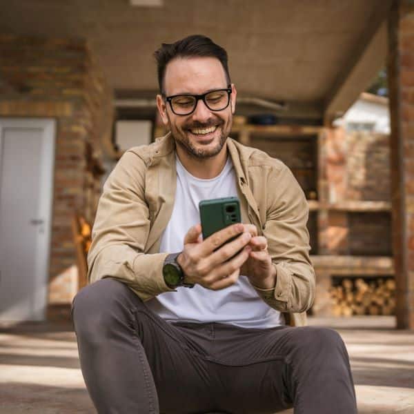 man reading an association email on his phone